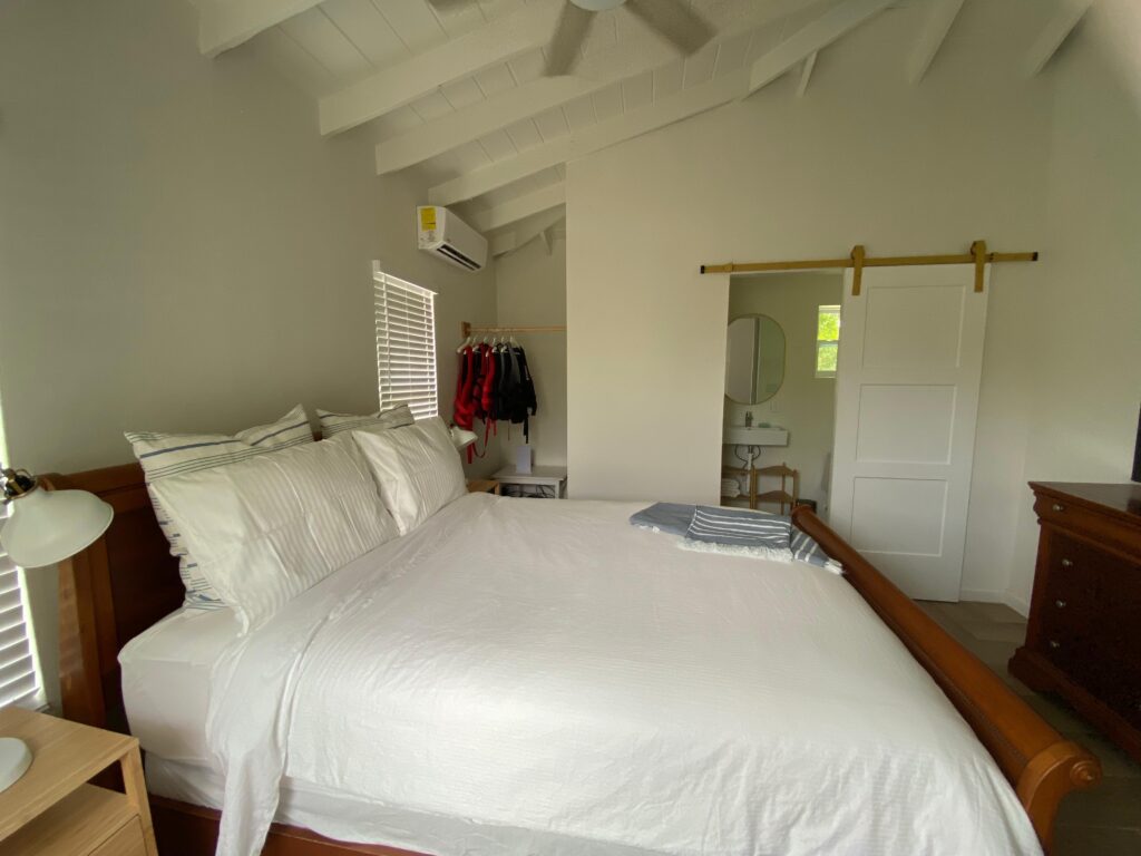 Queen bed in master bedroom of Sunset Turtle Rental Beach Villa